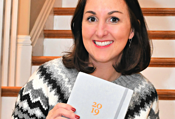 woman holding a ponderlily planner