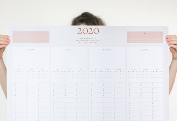 Woman holding the 2020 wall calendar by Ponderlily