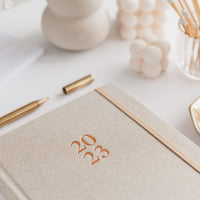 Linen cover of the 2023 Ponderlily Weekly planner in Linen